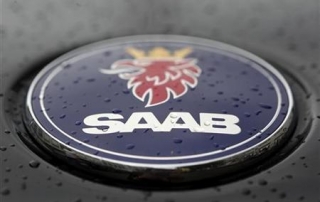 A Saab logo covered with rain drops is seen on a vehicle in Zurich
