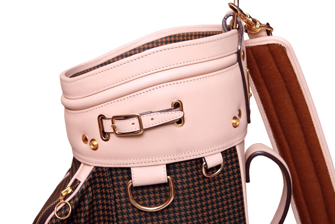 Padded shoulder strap of a women's golf bag for comfortable carrying.