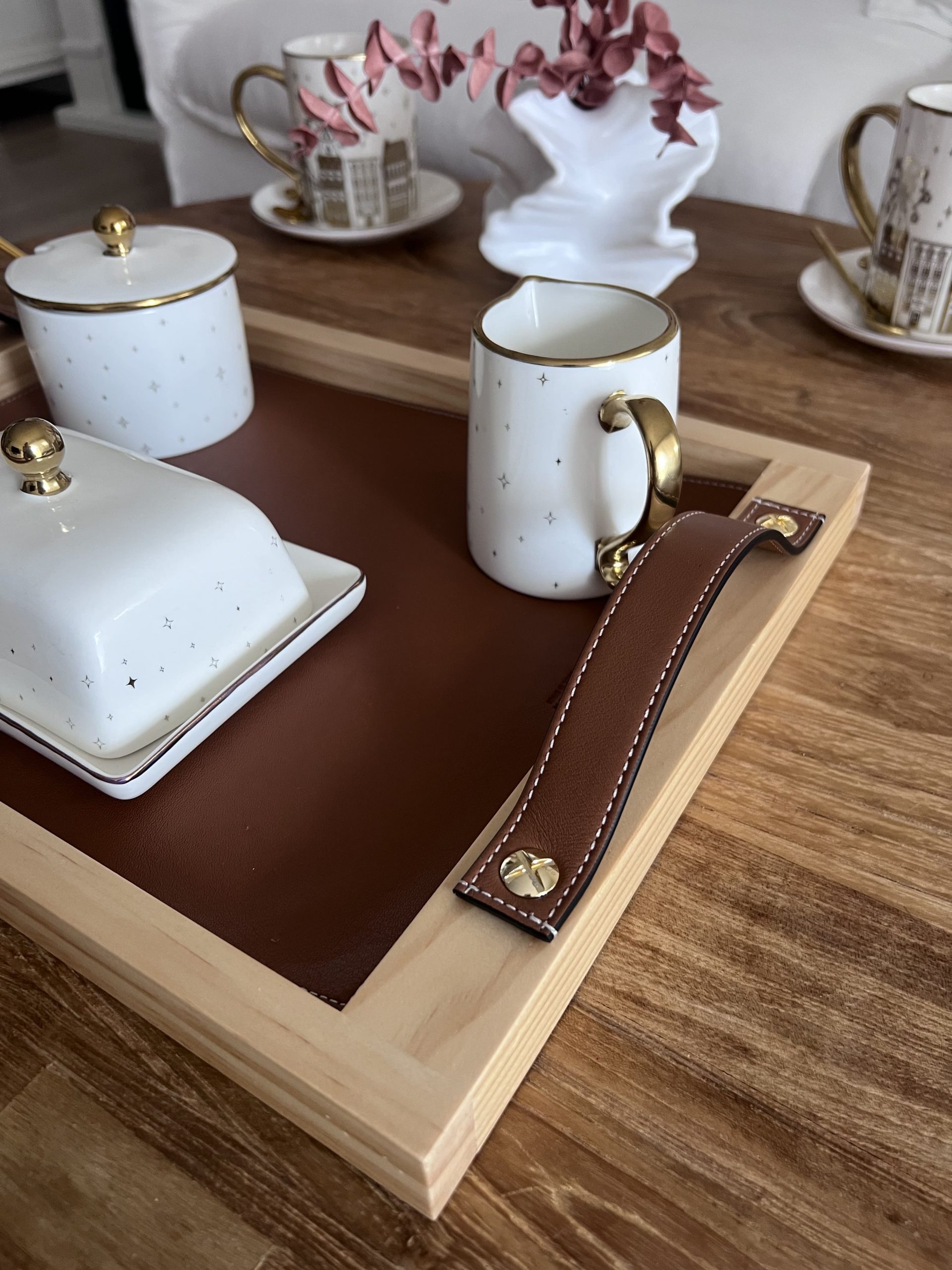 Wooden tray with leather handles and decorative cups