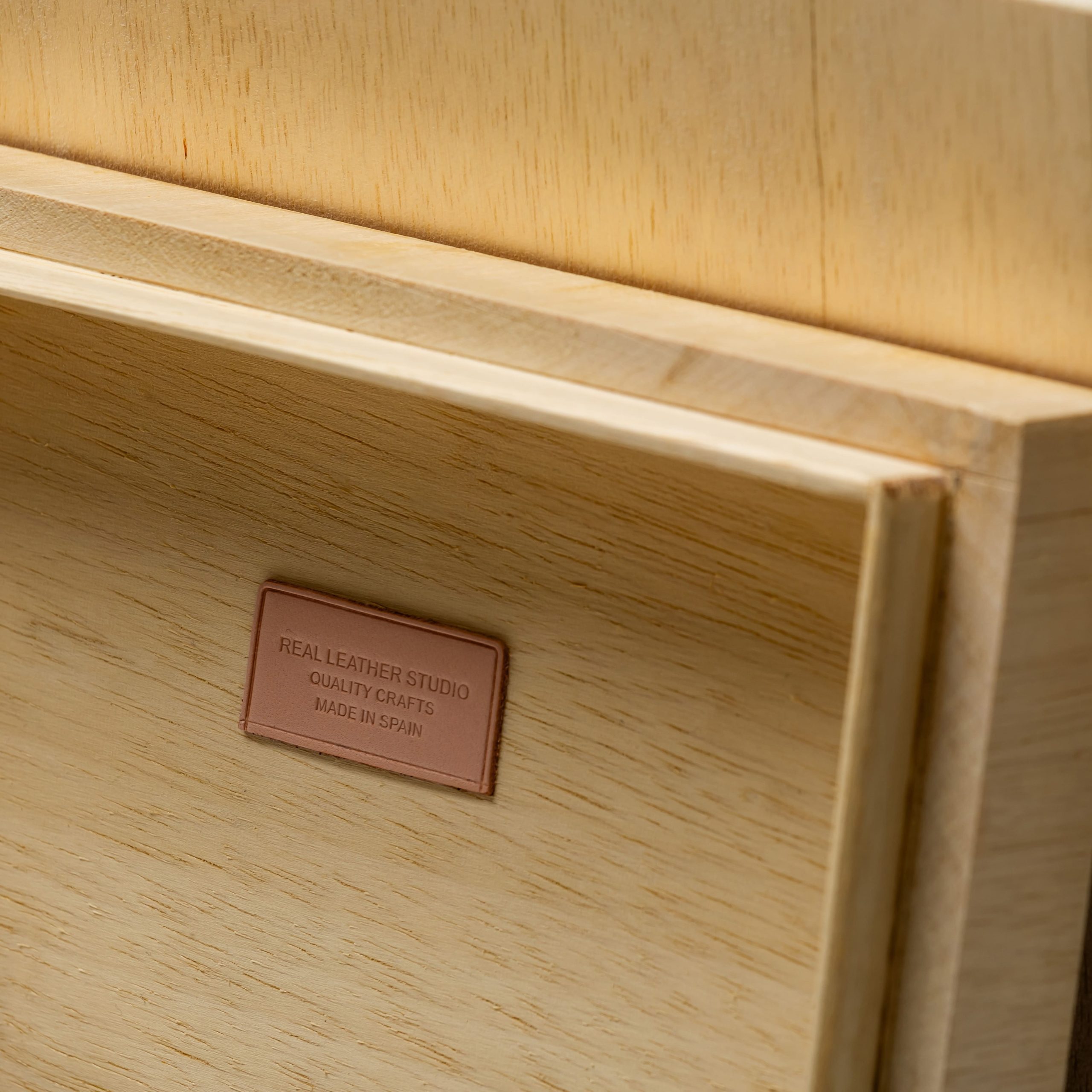 Wood and leather box with natural wool blanket engraved label detail
