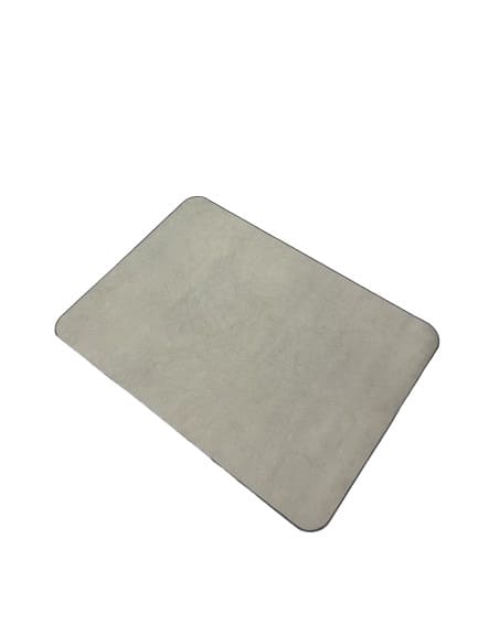 Sand coloured canvas pet food mat with a rectangular design and leather trim.