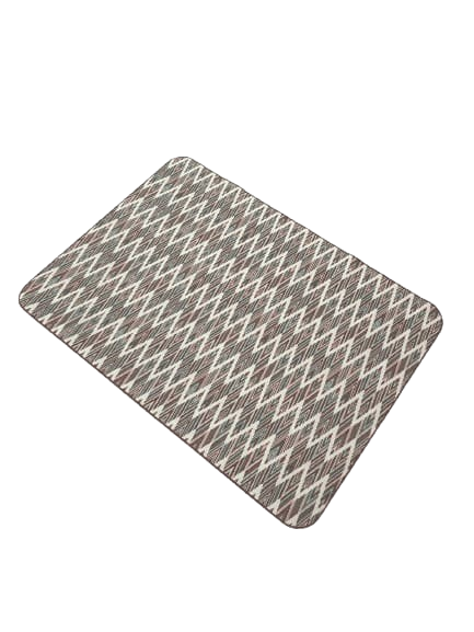 Overhead view of the rectangular pet food mat made of ethnic canvas with a zig-zag pattern.